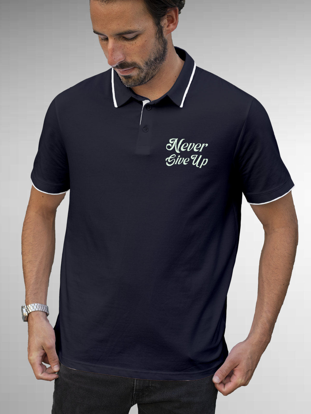 Model wearing Men's Navy Blue Polo T-shirt with 'Never Give Up' design, offering effortless style and premium comfort