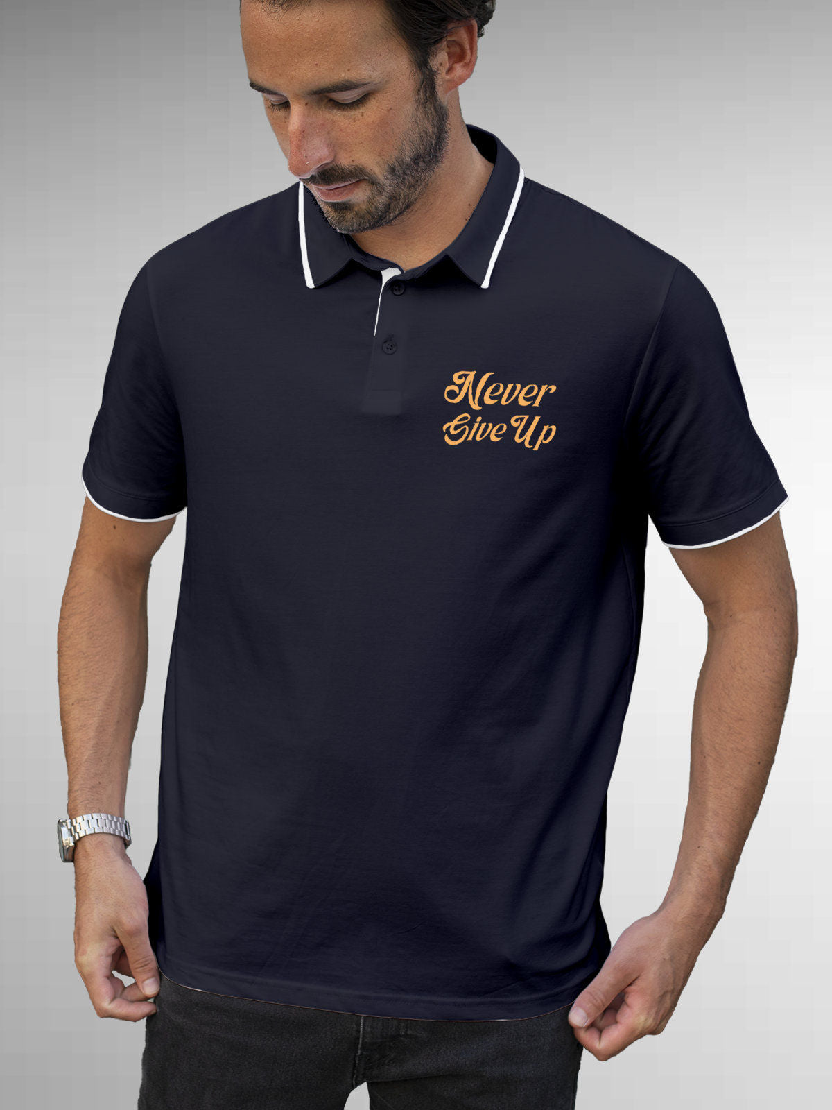 Model wearing Men's Navy Blue Polo T-shirt with 'Never Give Up' design, offering effortless style and premium comfort