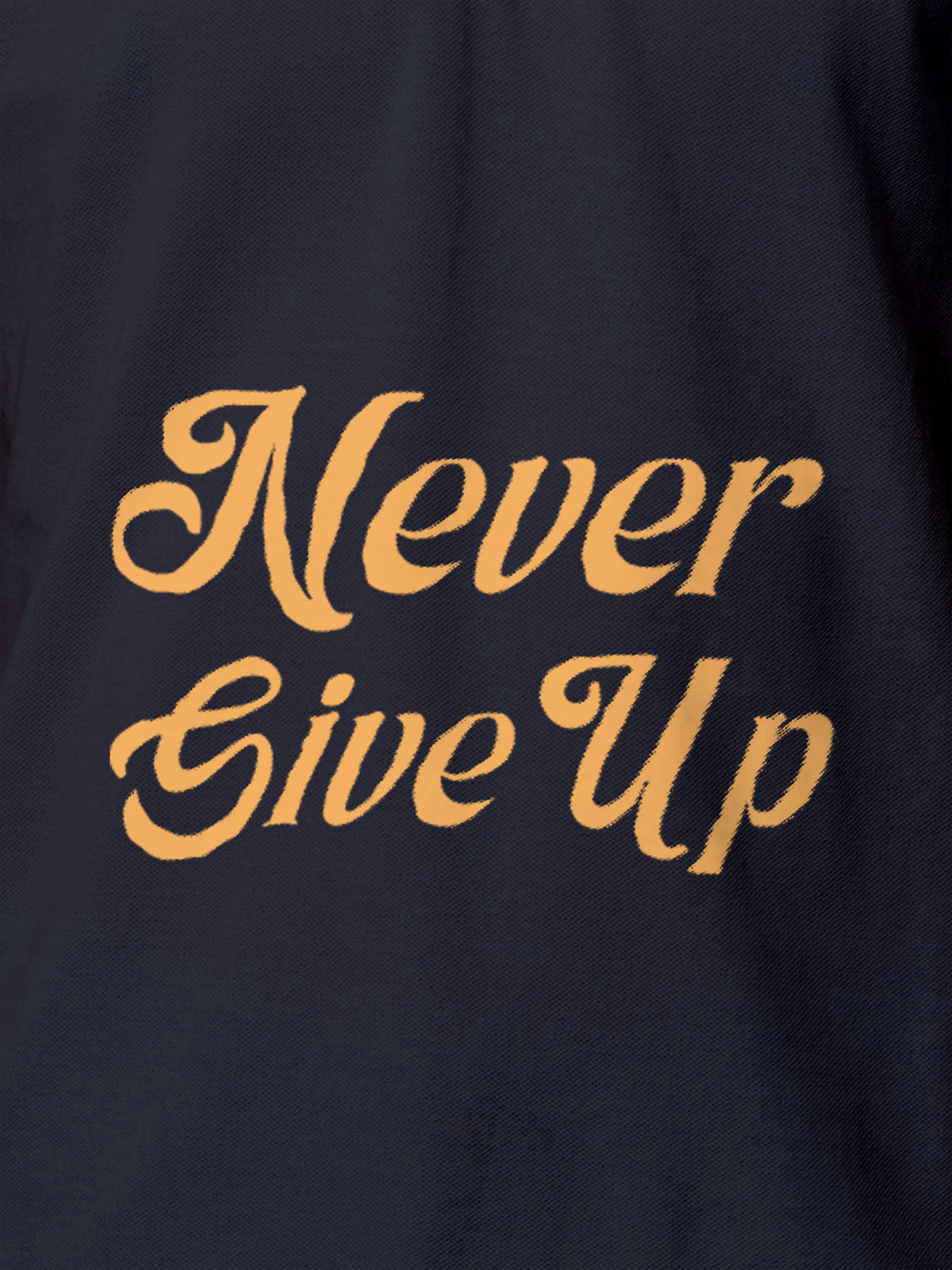Close up of 'Never Give Up' design on Men's Navy Blue Polo T-shirt, highlighting intricate details and vibrant print.