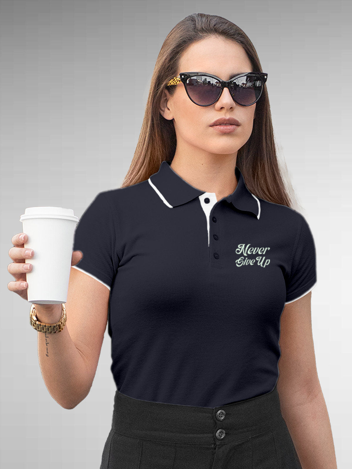 Model wearing Women's Navy Blue Polo T-shirt with 'Never Give Up' design, offering effortless style and premium comfort