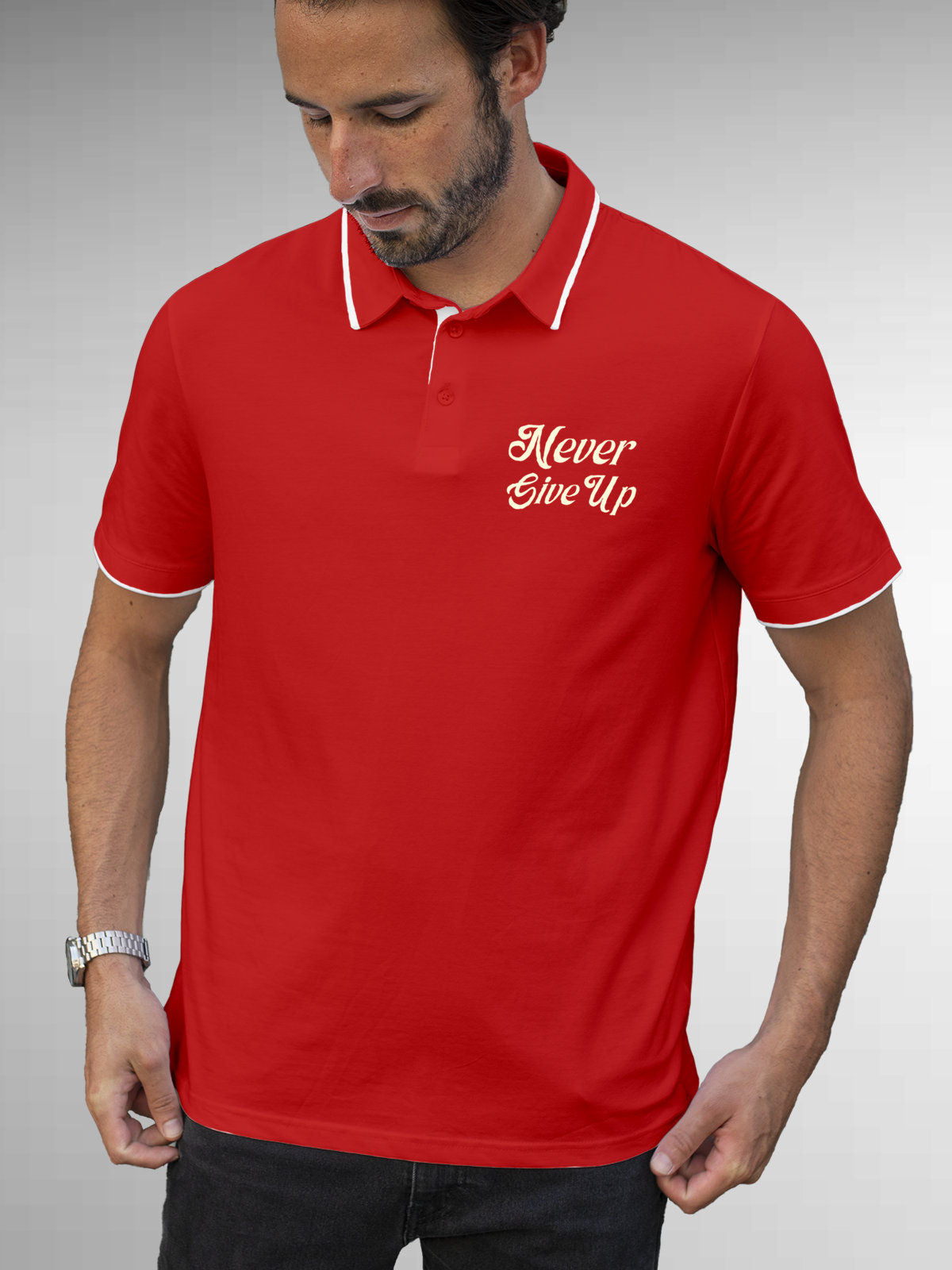 Model wearing Men's Red Polo T-shirt with 'Never Give Up' design, offering effortless style and premium comfort