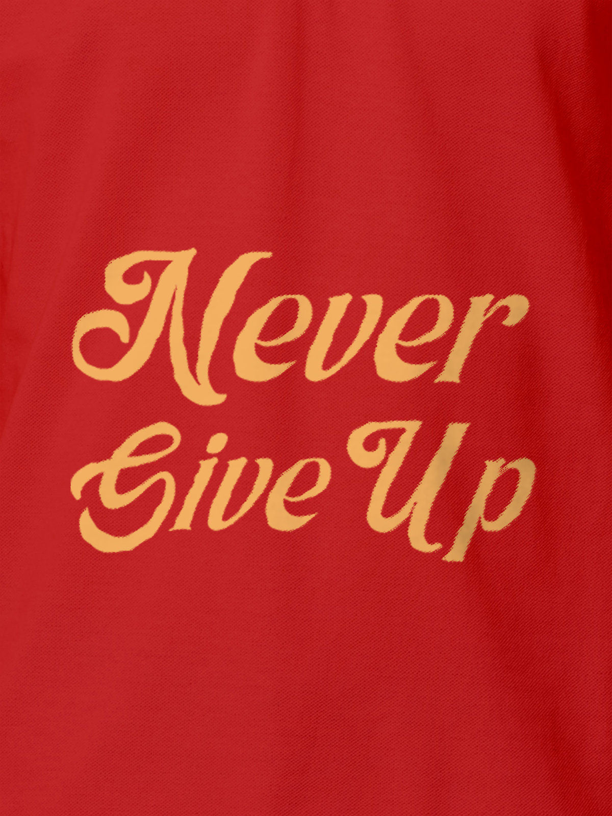 Close up of 'Never Give Up' design on Men's Red Polo T-shirt, highlighting intricate details and vibrant print.