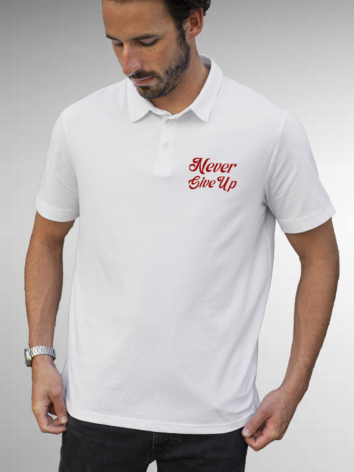 Model wearing Men's White Polo T-shirt with 'Never Give Up' design, offering effortless style and premium comfort