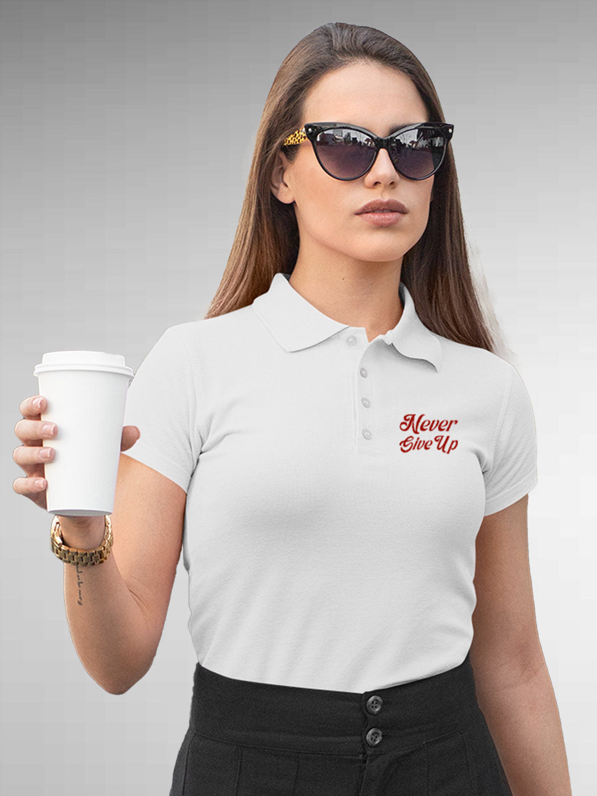 Model wearing Women's White Polo T-shirt with 'Never Give Up' design, offering effortless style and premium comfort