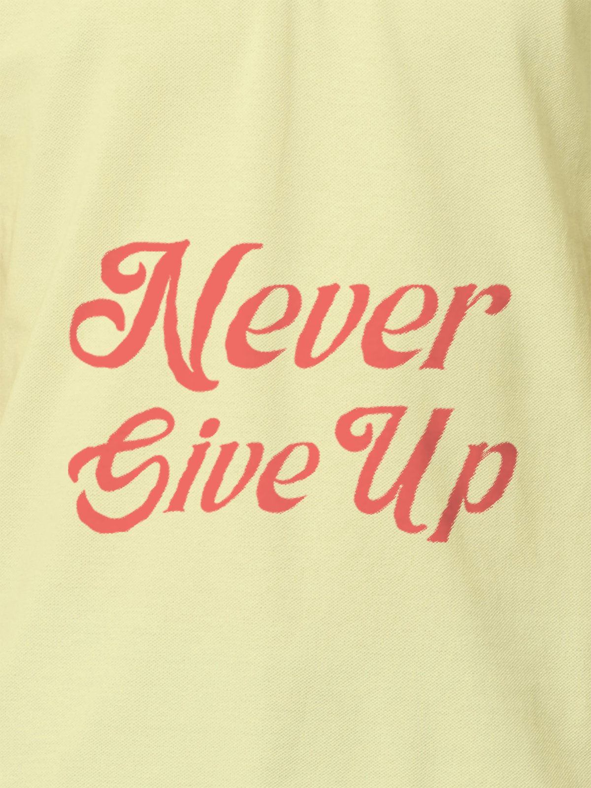 Close up of 'Never Give Up' design on Men's Yellow Polo T-shirt, highlighting intricate details and vibrant print.