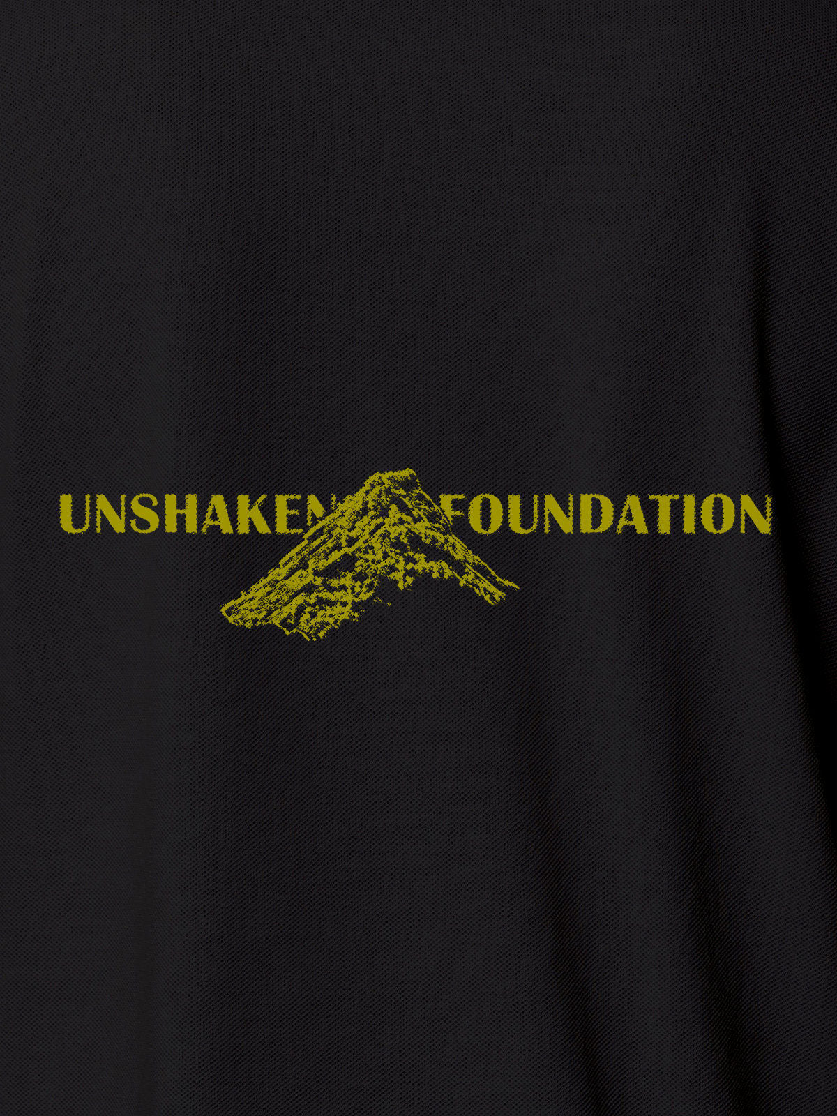 Close up of 'Unshaken Foundation' design on Men's Dark Grey Polo T-shirt, highlighting intricate details and vibrant print.