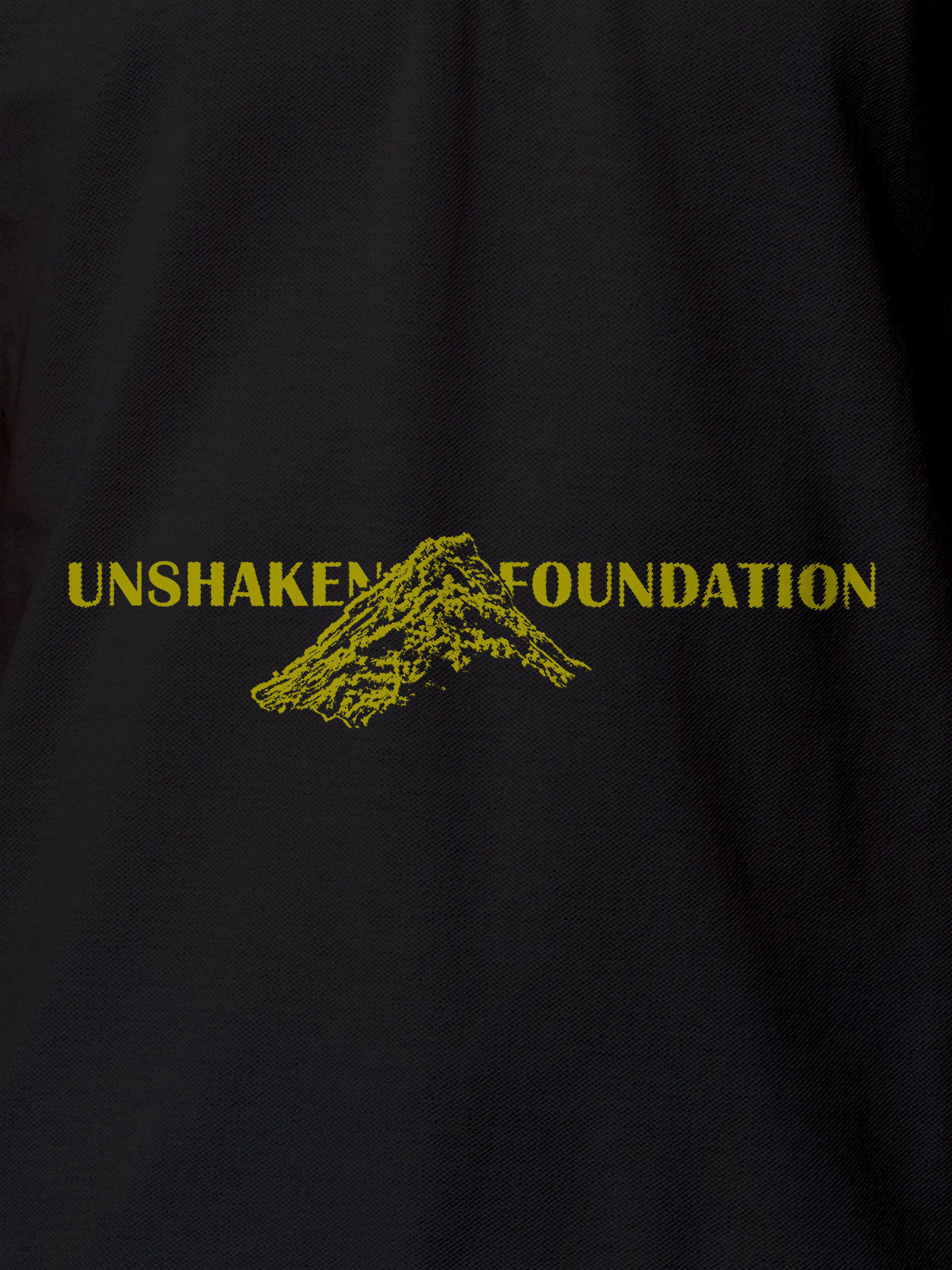 Close up of 'Unshaken Foundation' design on Women's Dark Grey Polo T-shirt, highlighting intricate details and vibrant print.