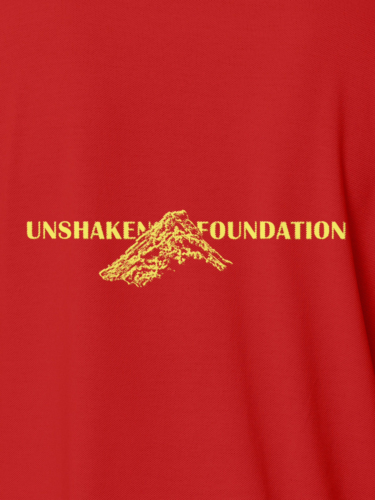Close up of 'Unshaken Foundation' design on Men's Red Polo T-shirt, highlighting intricate details and vibrant print.