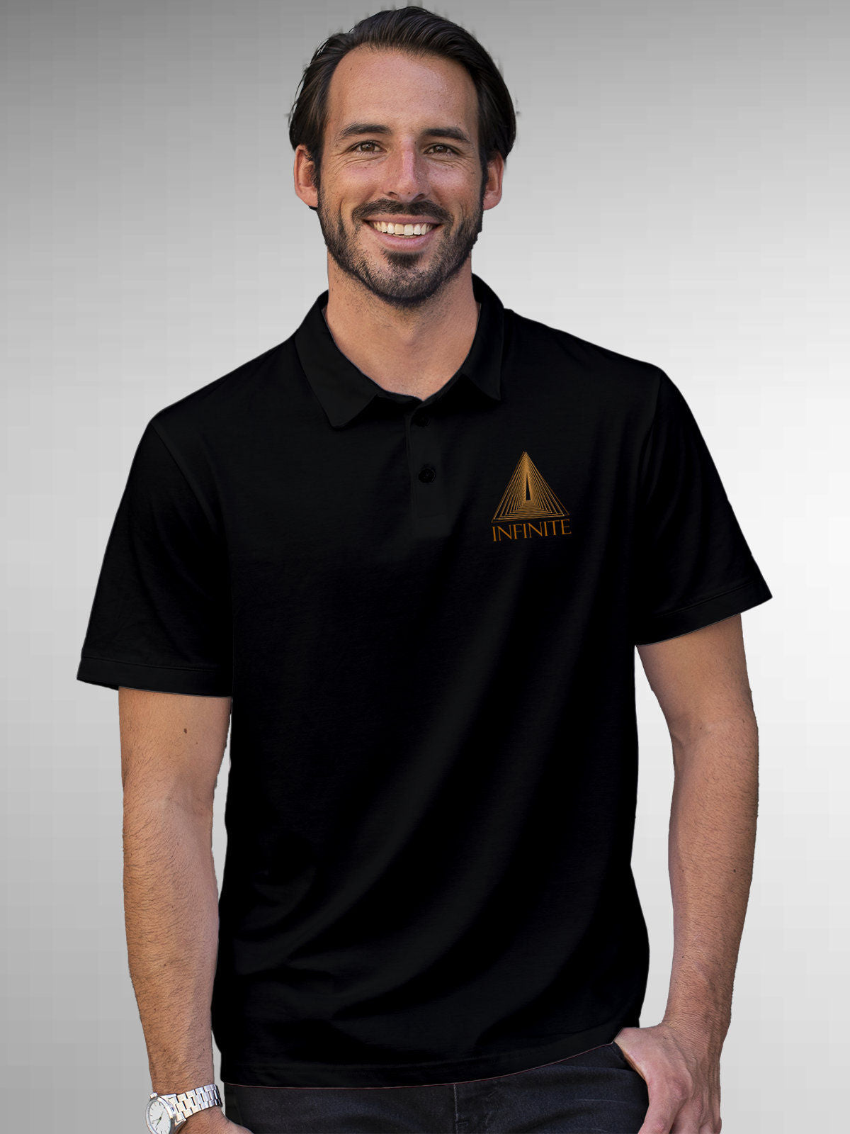 Model wearing Men's Black Polo T-shirt with 'Go Infinite' design, offering effortless style and premium comfort