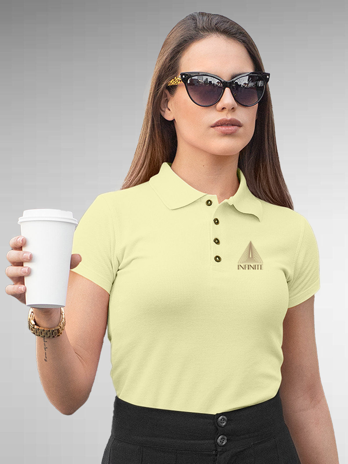 Model wearing Women's Yellow Polo T-shirt with 'Go Infinite' design, offering effortless style and premium comfort