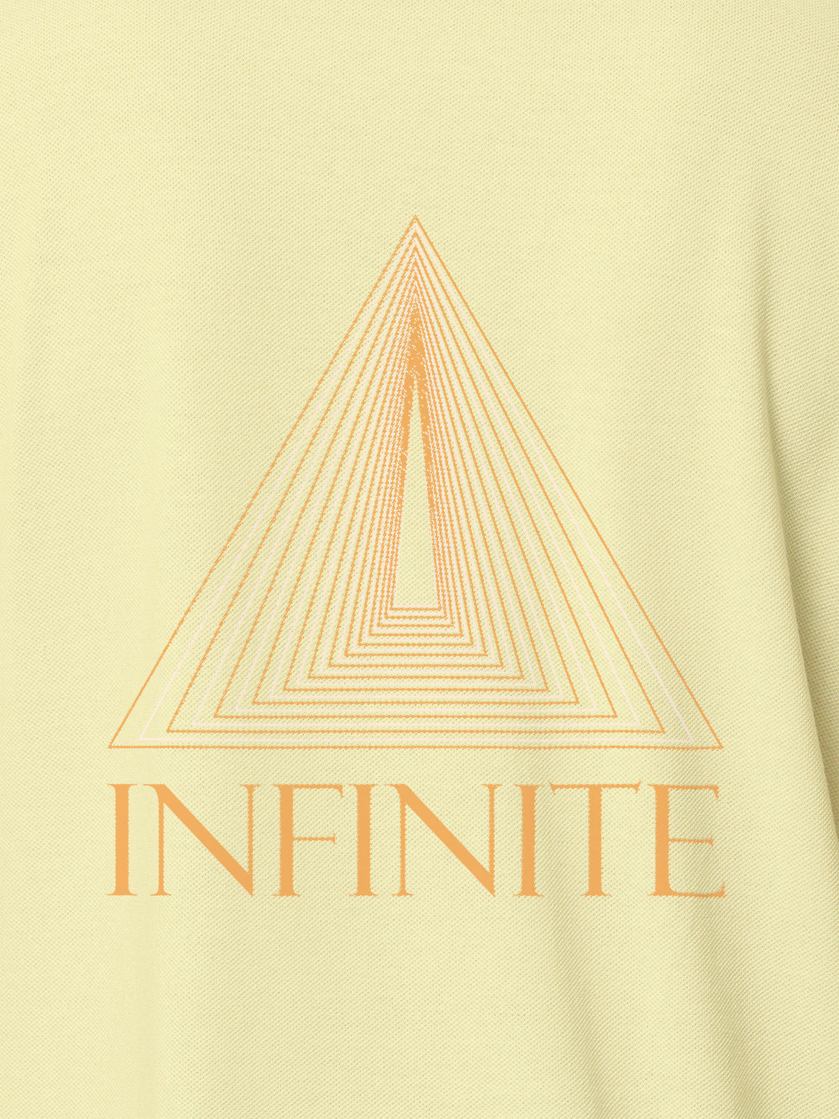 Close up of 'Go Infinite' design on Women's Yellow Polo T-shirt, highlighting intricate details and vibrant print.