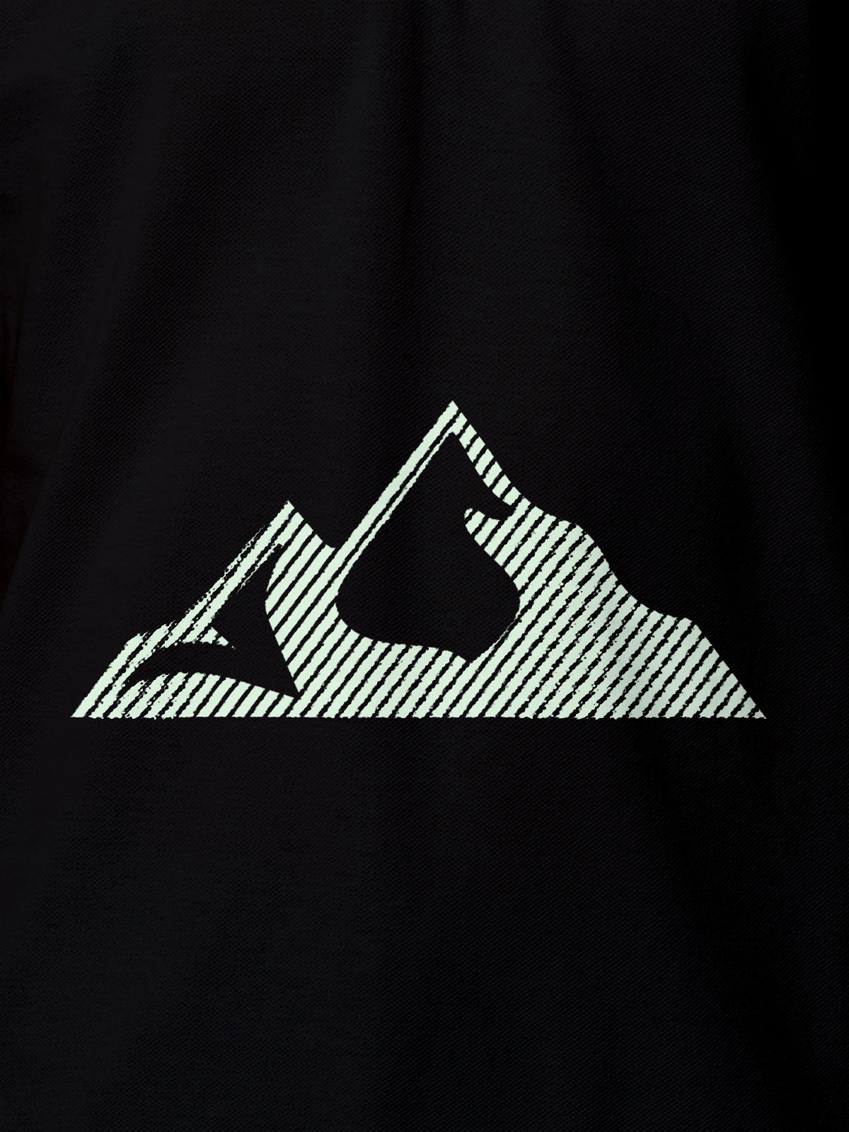Close up of 'Grit' design on Men's Black Polo T-shirt, highlighting intricate details and vibrant print.