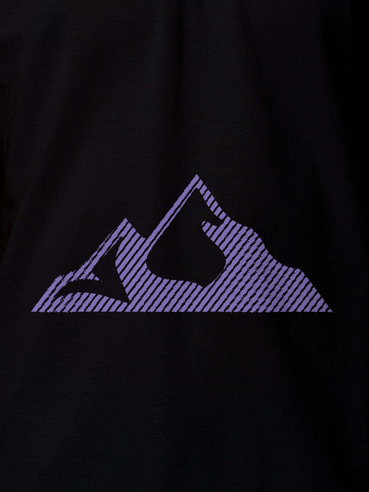 Close up of 'Grit' design on Men's Black Polo T-shirt, highlighting intricate details and vibrant print.