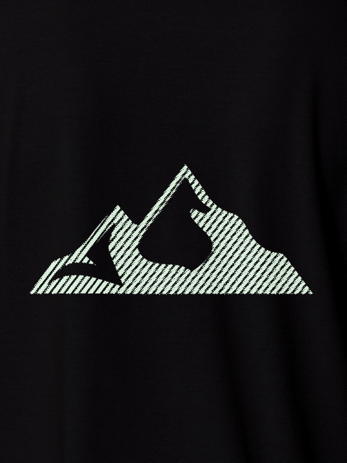 Close up of 'Grit' design on Women's Black Polo T-shirt, highlighting intricate details and vibrant print.