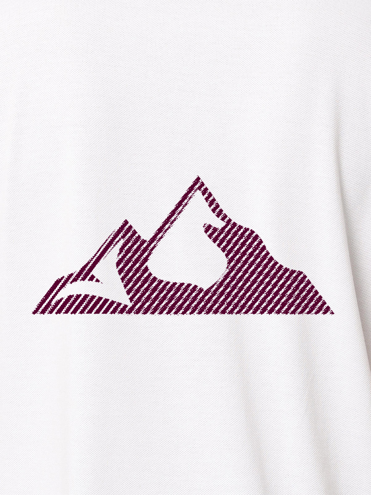 Close up of 'Grit' design on Women's White Polo T-shirt, highlighting intricate details and vibrant print.