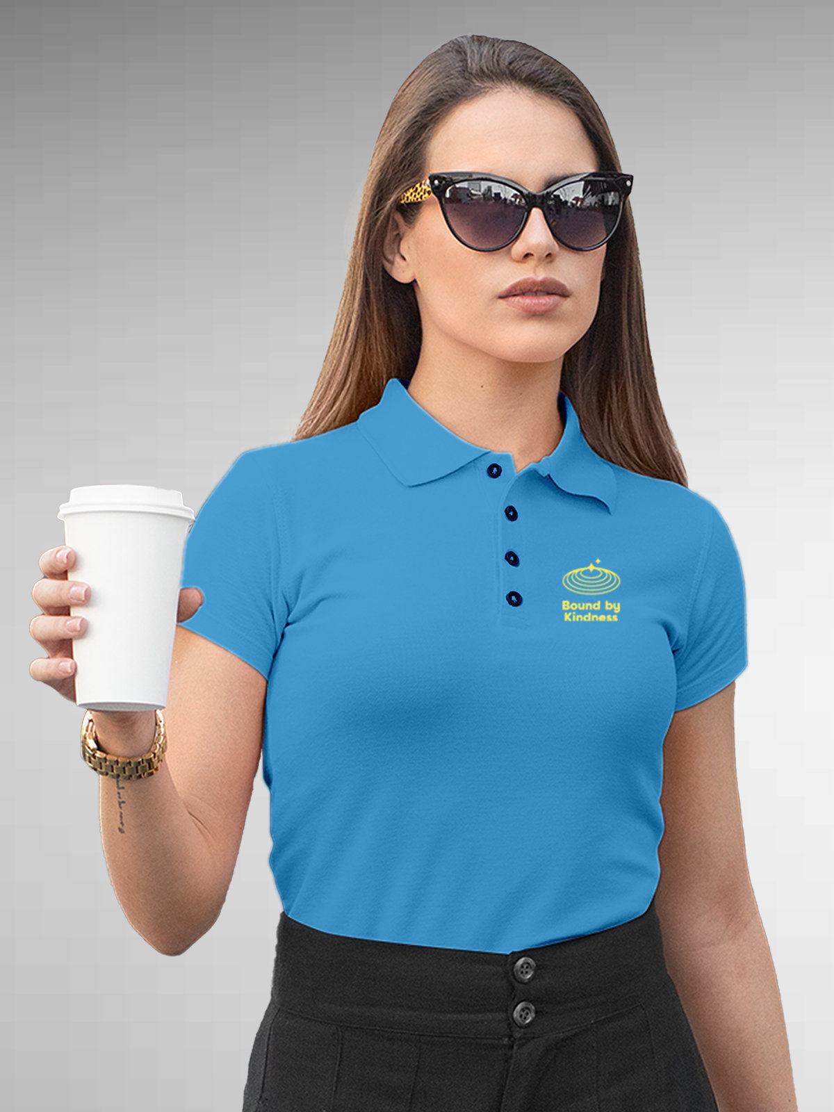 Model wearing Women's Blue Polo T-shirt with 'Bound By Kindness' design, offering effortless style and premium comfort