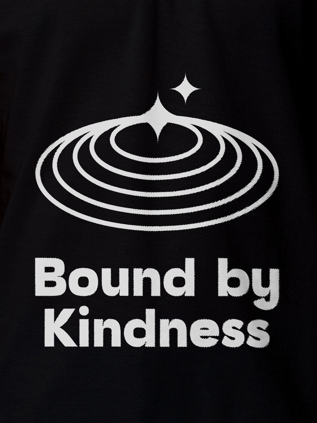 Close up of 'Bound By Kindness' design on Men's Black Polo T-shirt, highlighting intricate details and vibrant print.