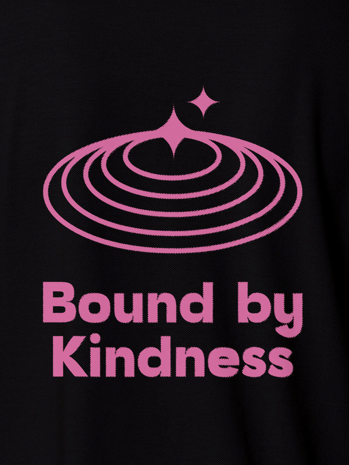Close up of 'Bound By Kindness' design on Women's Black Polo T-shirt, highlighting intricate details and vibrant print.