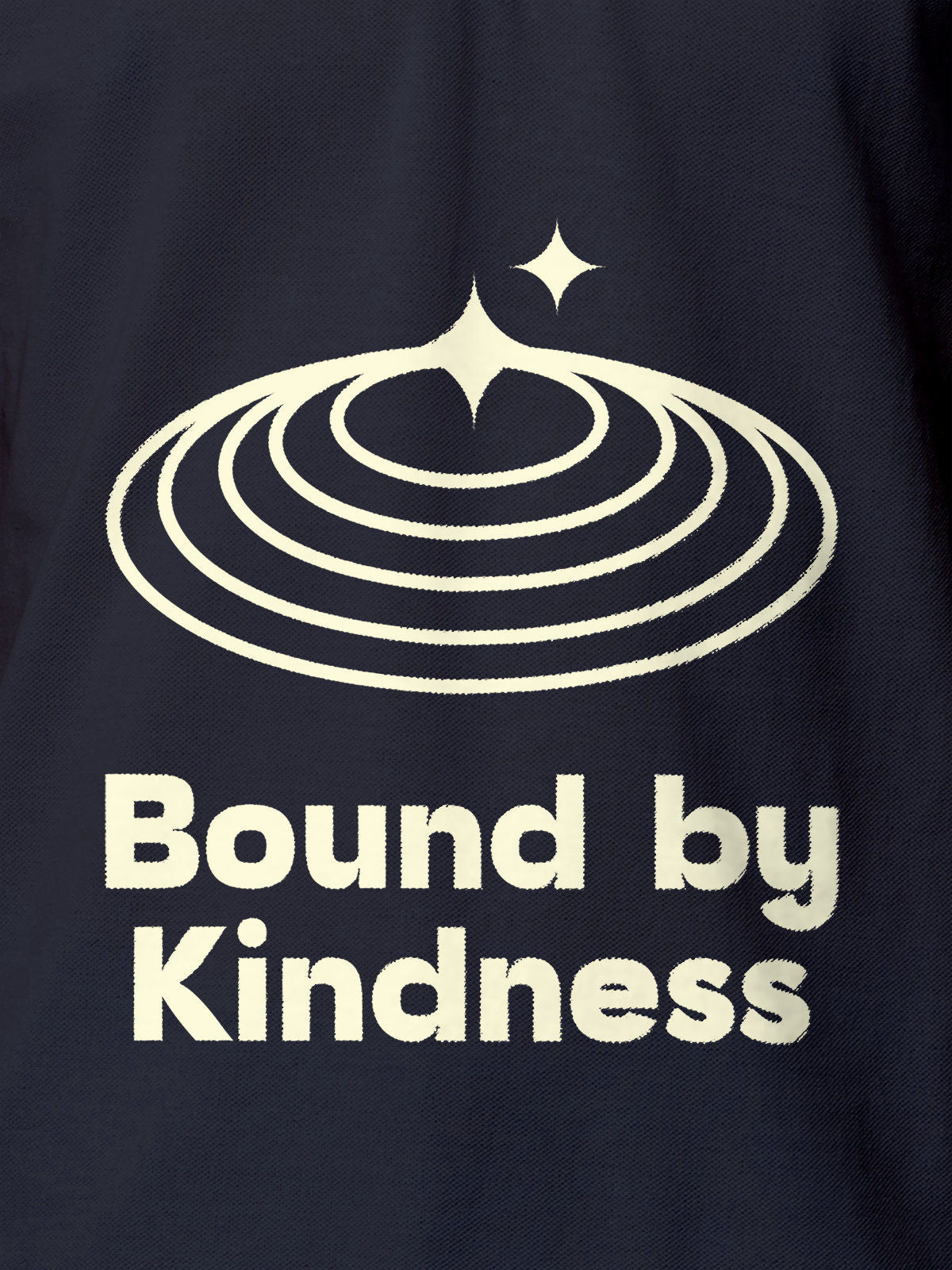 Close up of 'Bound By Kindness' design on Men's Navy Blue Polo T-shirt, highlighting intricate details and vibrant print.