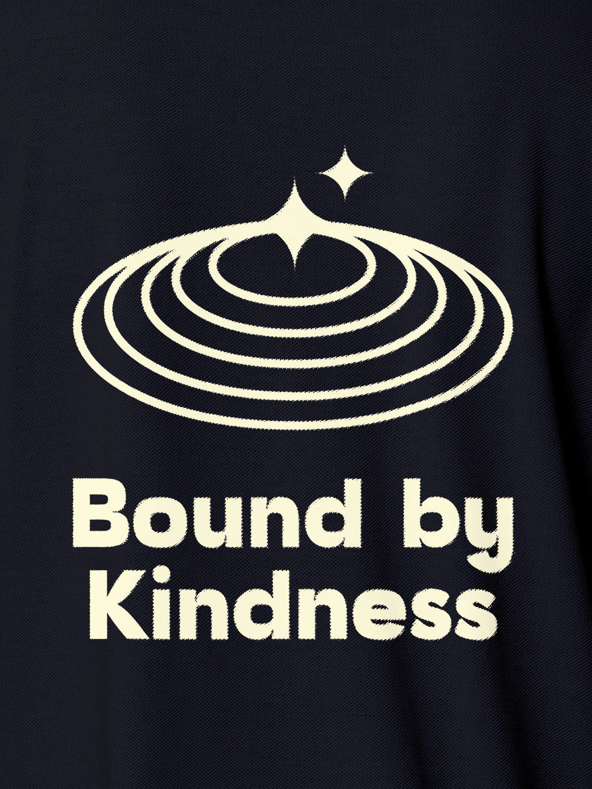 Close up of 'Bound By Kindness' design on Women's Navy Blue Polo T-shirt, highlighting intricate details and vibrant print.