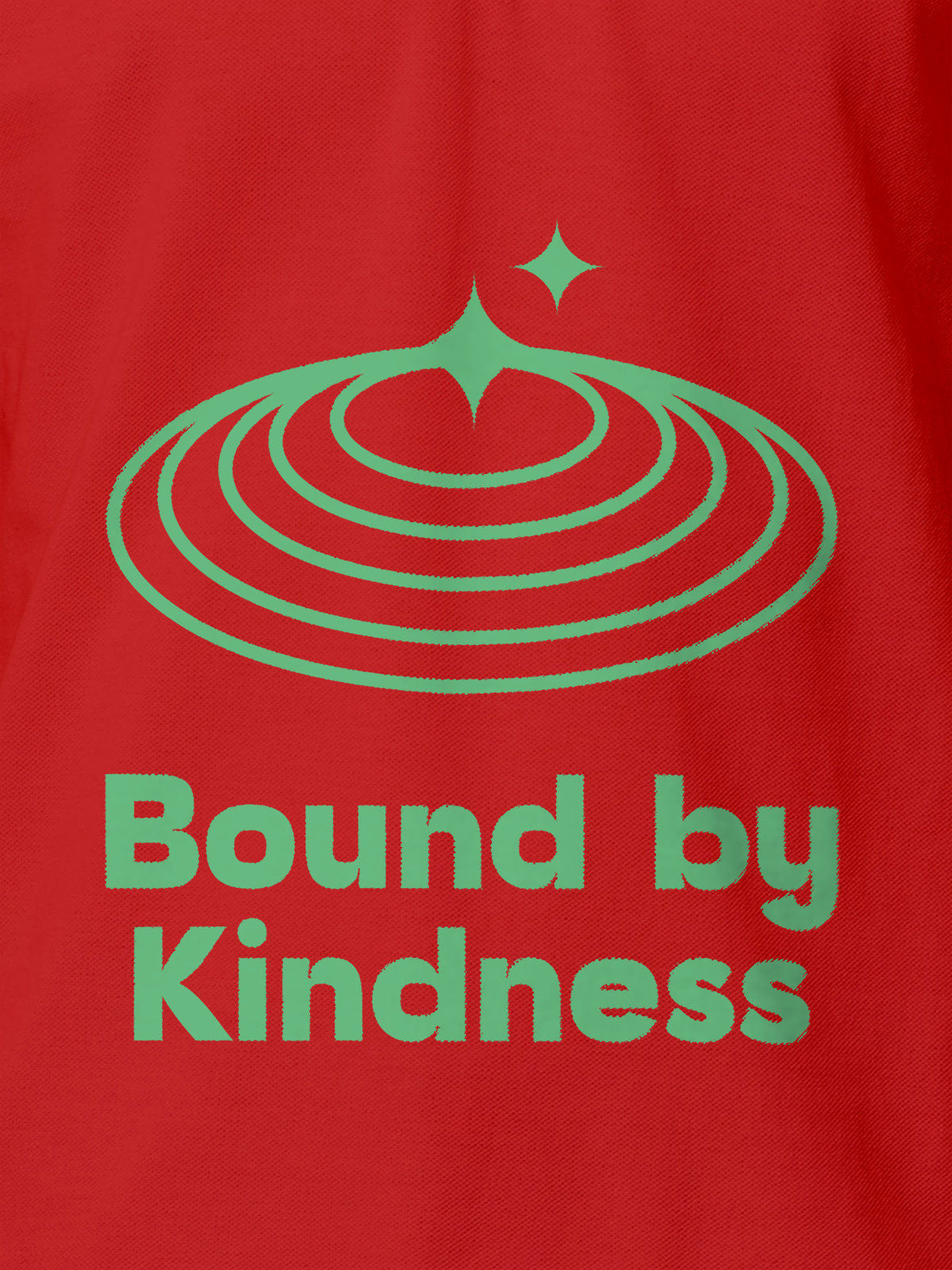 Close up of 'Bound By Kindness' design on Men's Red Polo T-shirt, highlighting intricate details and vibrant print.