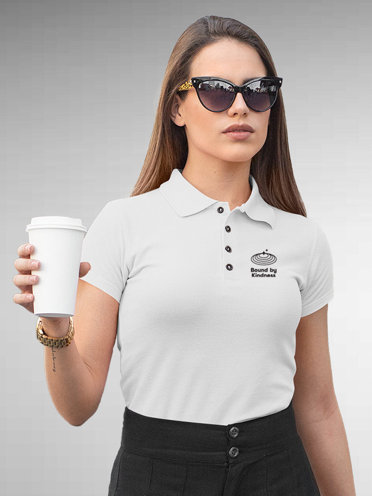 Model wearing Women's White Polo T-shirt with 'Bound By Kindness' design, offering effortless style and premium comfort