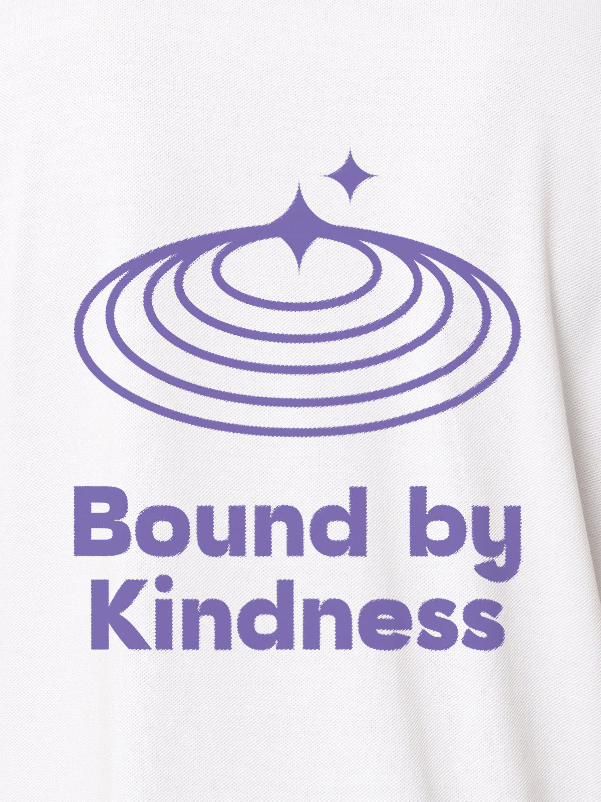 Close up of 'Bound By Kindness' design on Women's White Polo T-shirt, highlighting intricate details and vibrant print.