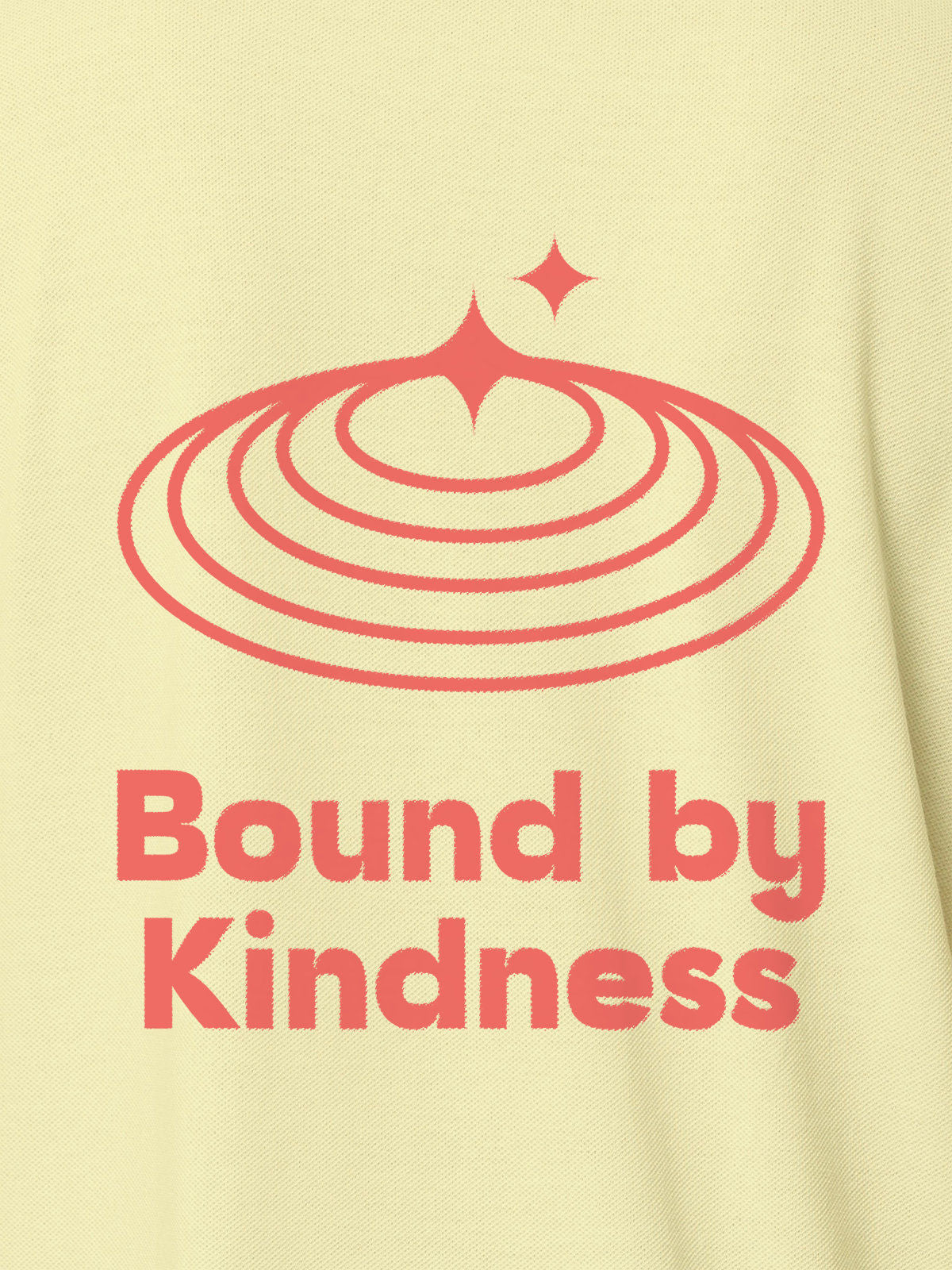 Close up of 'Bound By Kindness' design on Women's Yellow Polo T-shirt, highlighting intricate details and vibrant print.