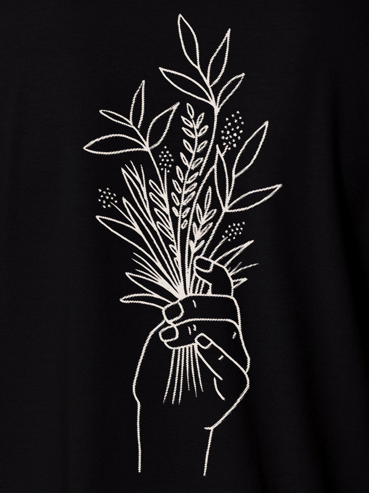 Close up of 'Love and Joy' design on Men's Black Polo T-shirt, highlighting intricate details and vibrant print.