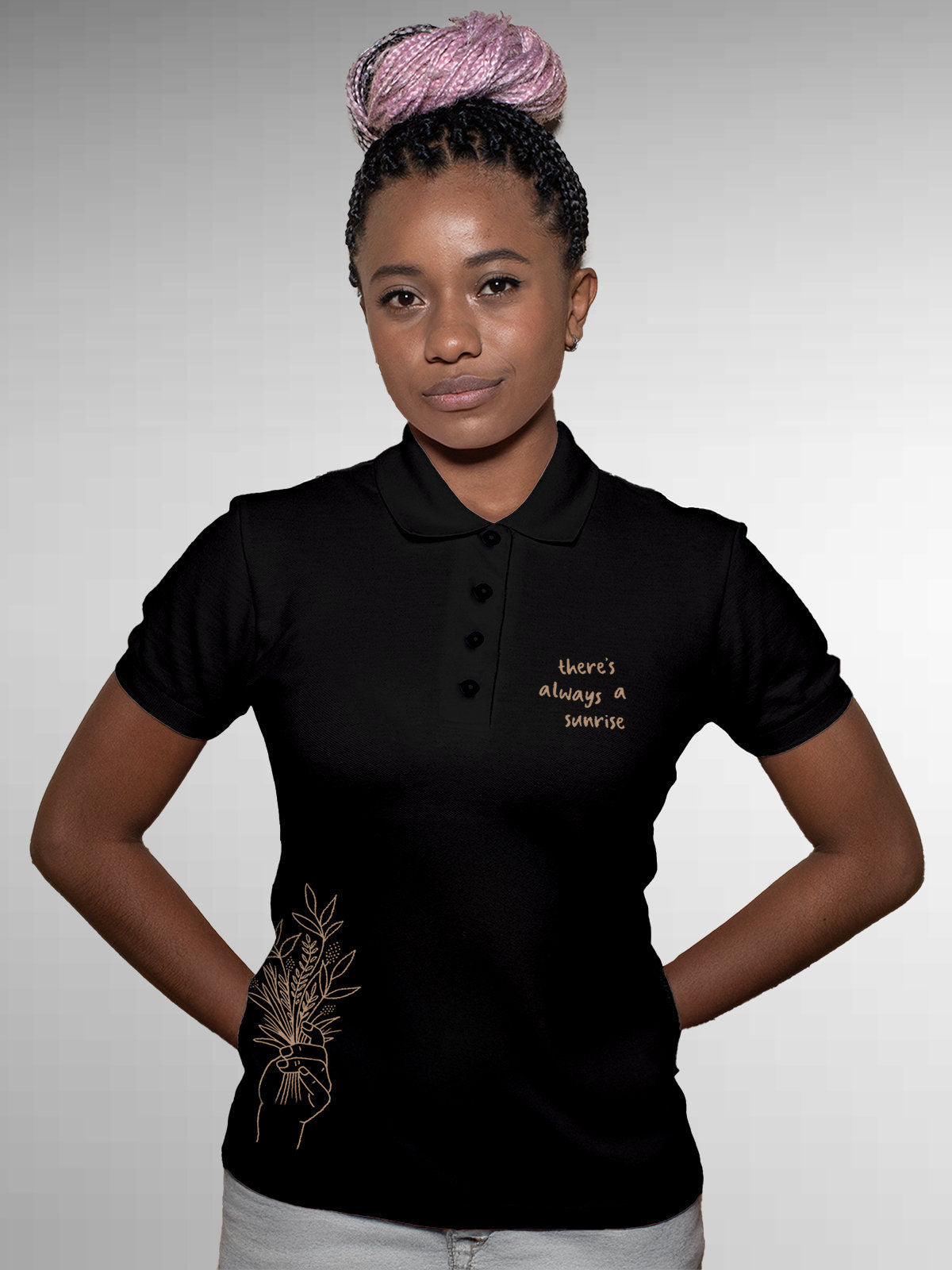 Model wearing Women's Black Polo T-shirt with 'There's Always a Sunrise' design, offering effortless style and premium comfort