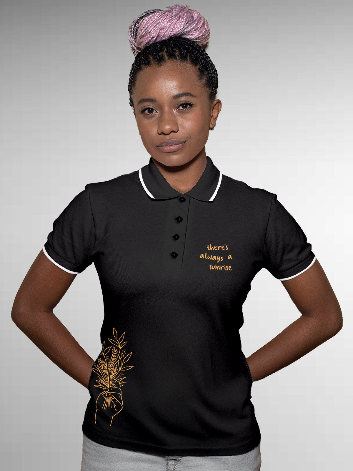 Model wearing Women's Dark Grey Polo T-shirt with 'There's Always a Sunrise' design, offering effortless style and premium comfort