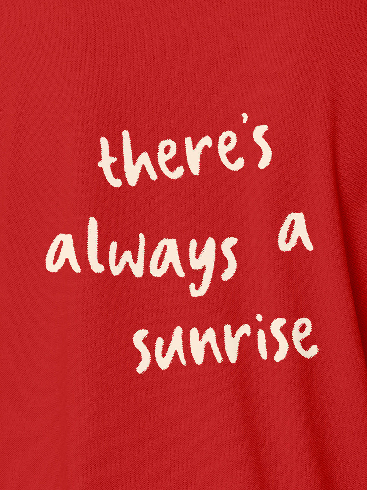 Close up of 'There's Always a Sunrise' design on Women's Red Polo T-shirt, highlighting intricate details and vibrant print.