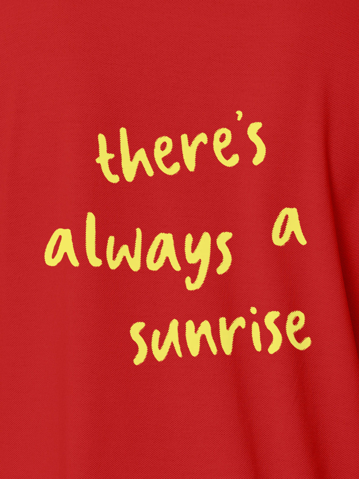 Close up of 'There's Always a Sunrise' design on Women's Red Polo T-shirt, highlighting intricate details and vibrant print.
