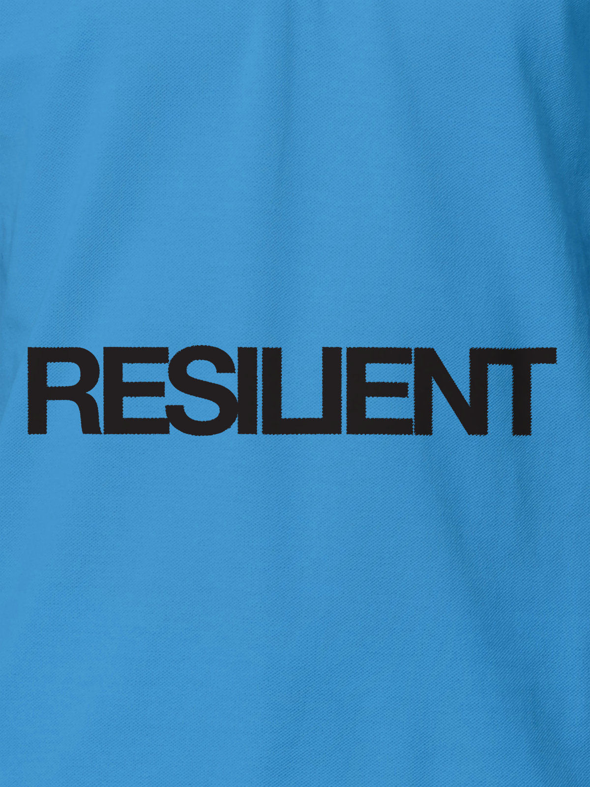 Close up of 'Resilient' design on Women's Blue Polo T-shirt, highlighting intricate details and vibrant print.