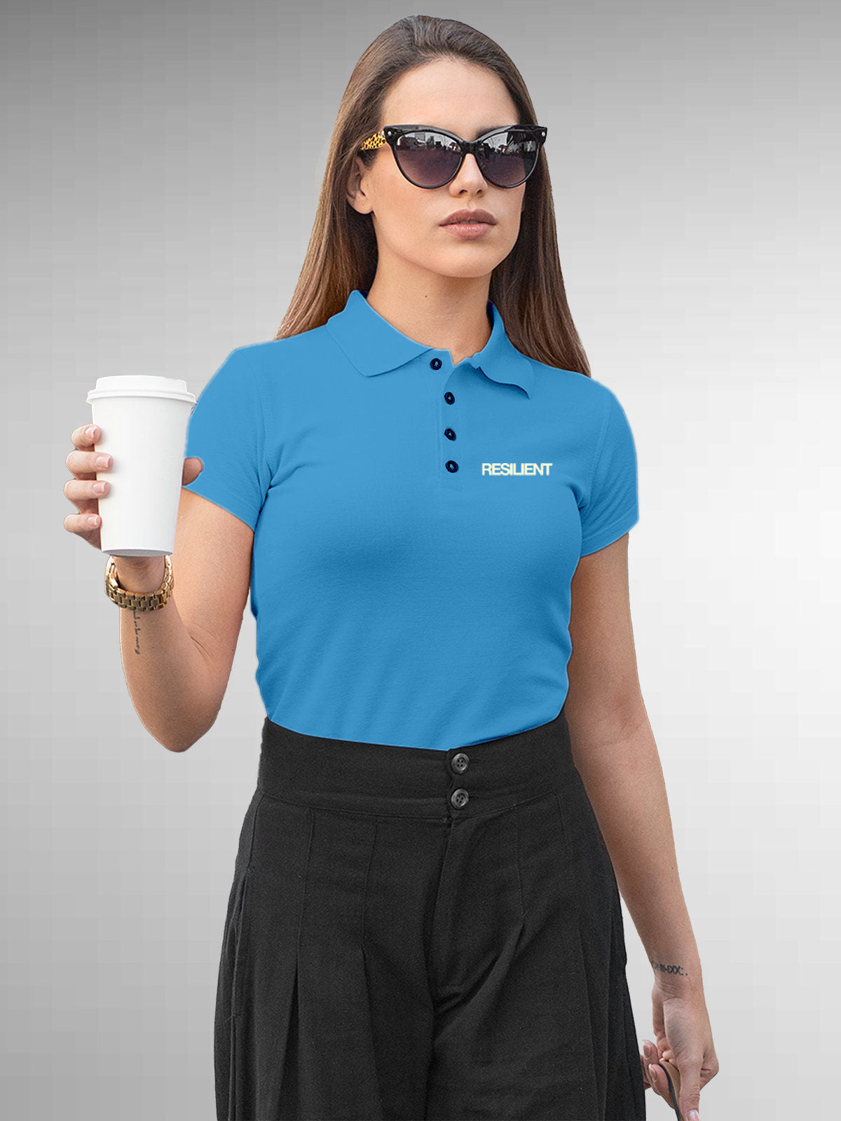 Model wearing Women's Blue Polo T-shirt with 'Resilient' design, offering effortless style and premium comfort