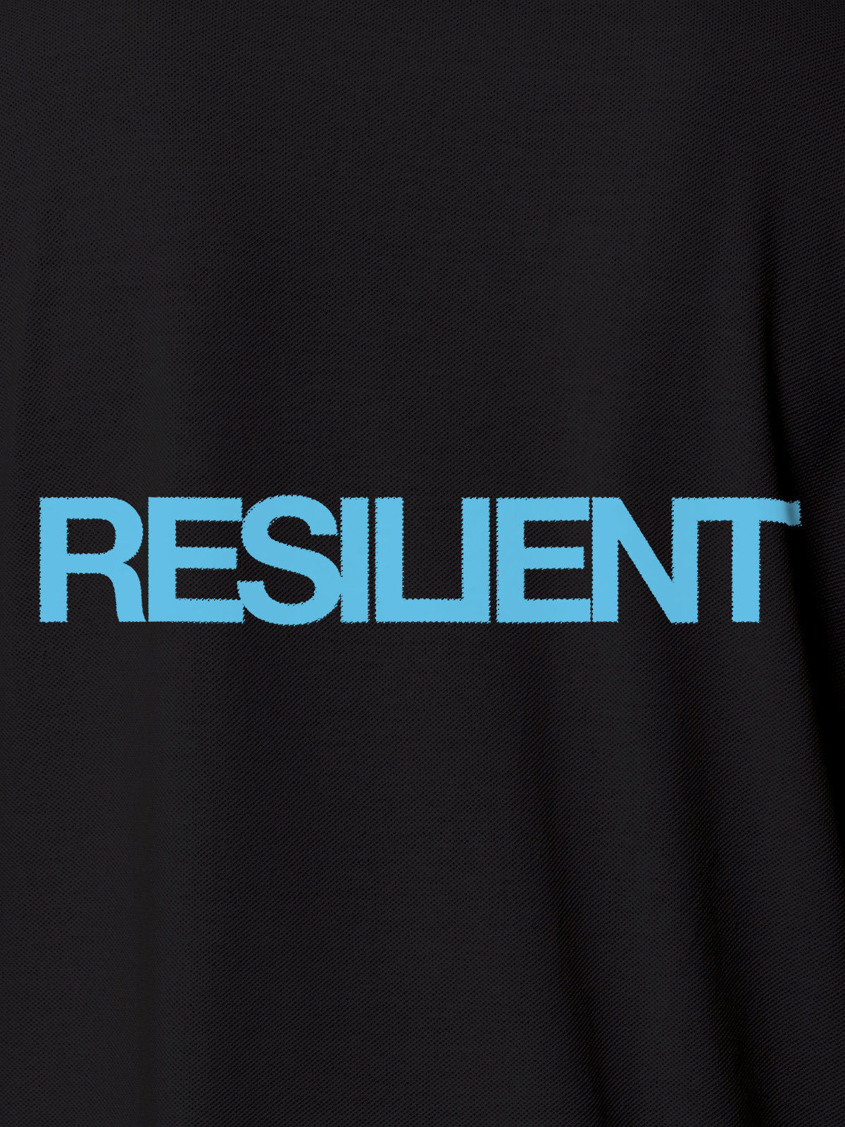 Close up of 'Resilient' design on Men's Dark Grey Polo T-shirt, highlighting intricate details and vibrant print.