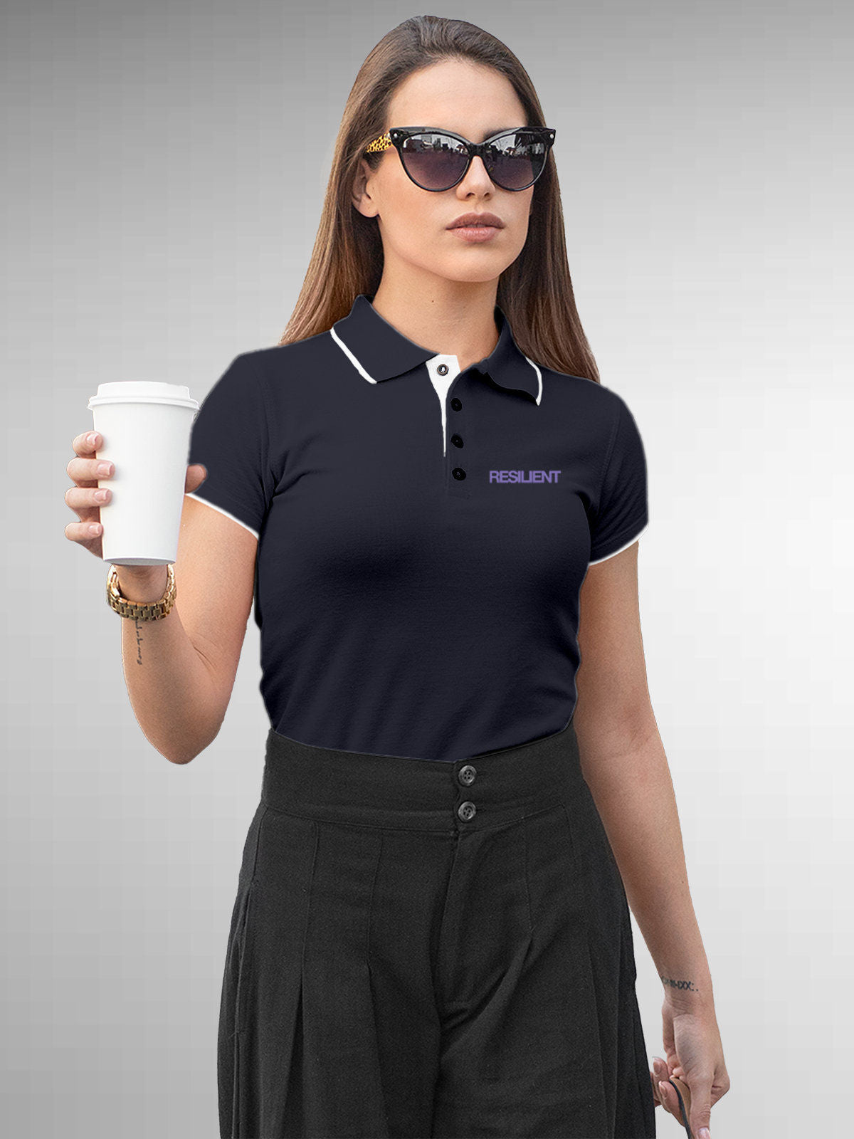 Model wearing Women's Navy Blue Polo T-shirt with 'Resilient' design, offering effortless style and premium comfort