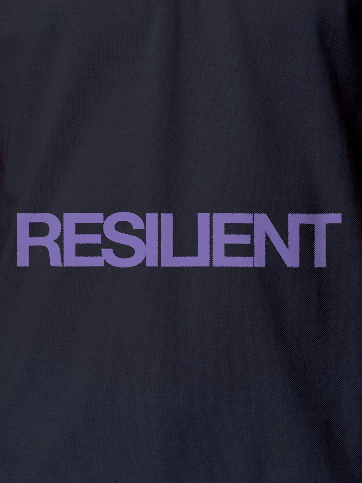 Close up of 'Resilient' design on Women's Navy Blue Polo T-shirt, highlighting intricate details and vibrant print.