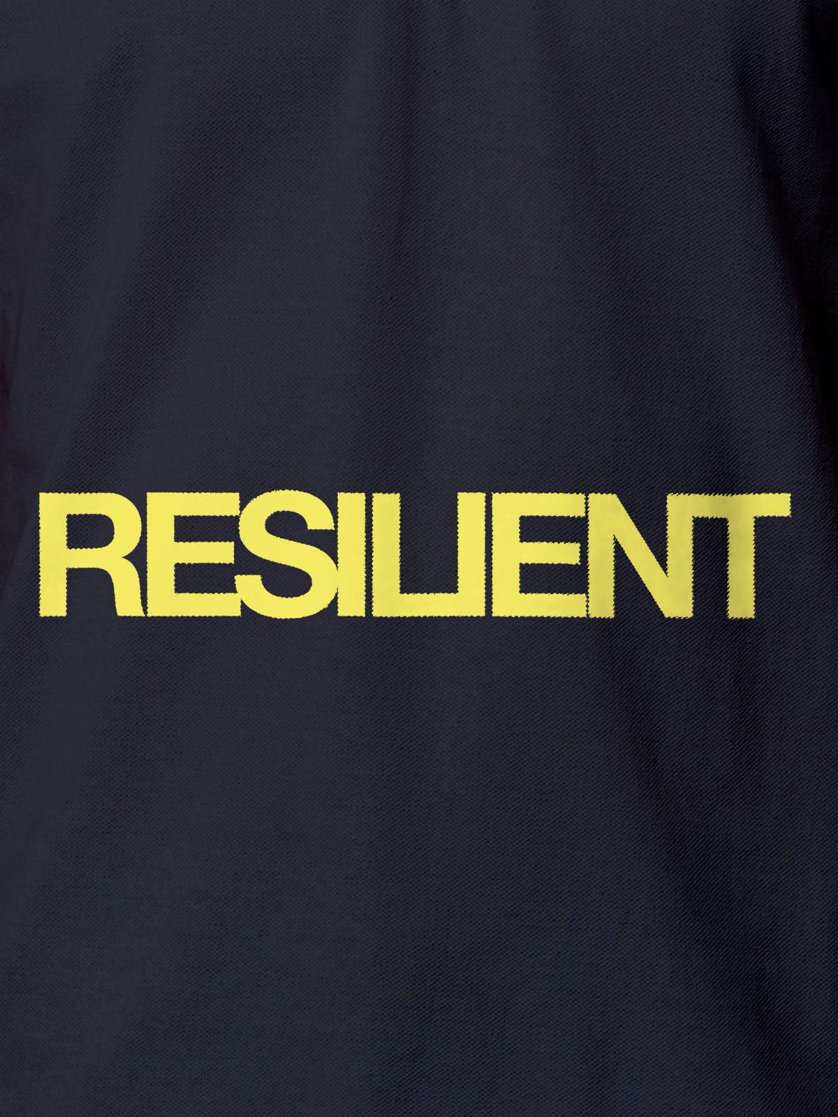 Close up of 'Resilient' design on Women's Navy Blue Polo T-shirt, highlighting intricate details and vibrant print.