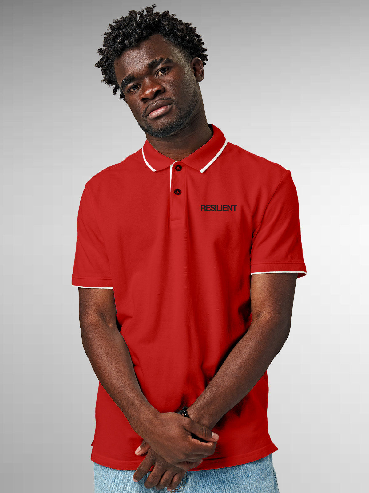 Model wearing Men's Red Polo T-shirt with 'Resilient' design, offering effortless style and premium comfort