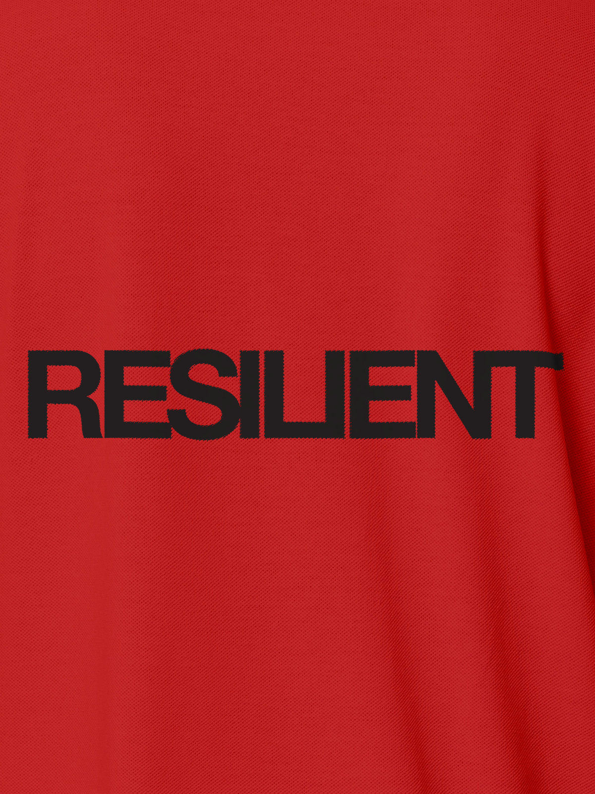 Close up of 'Resilient' design on Men's Red Polo T-shirt, highlighting intricate details and vibrant print.