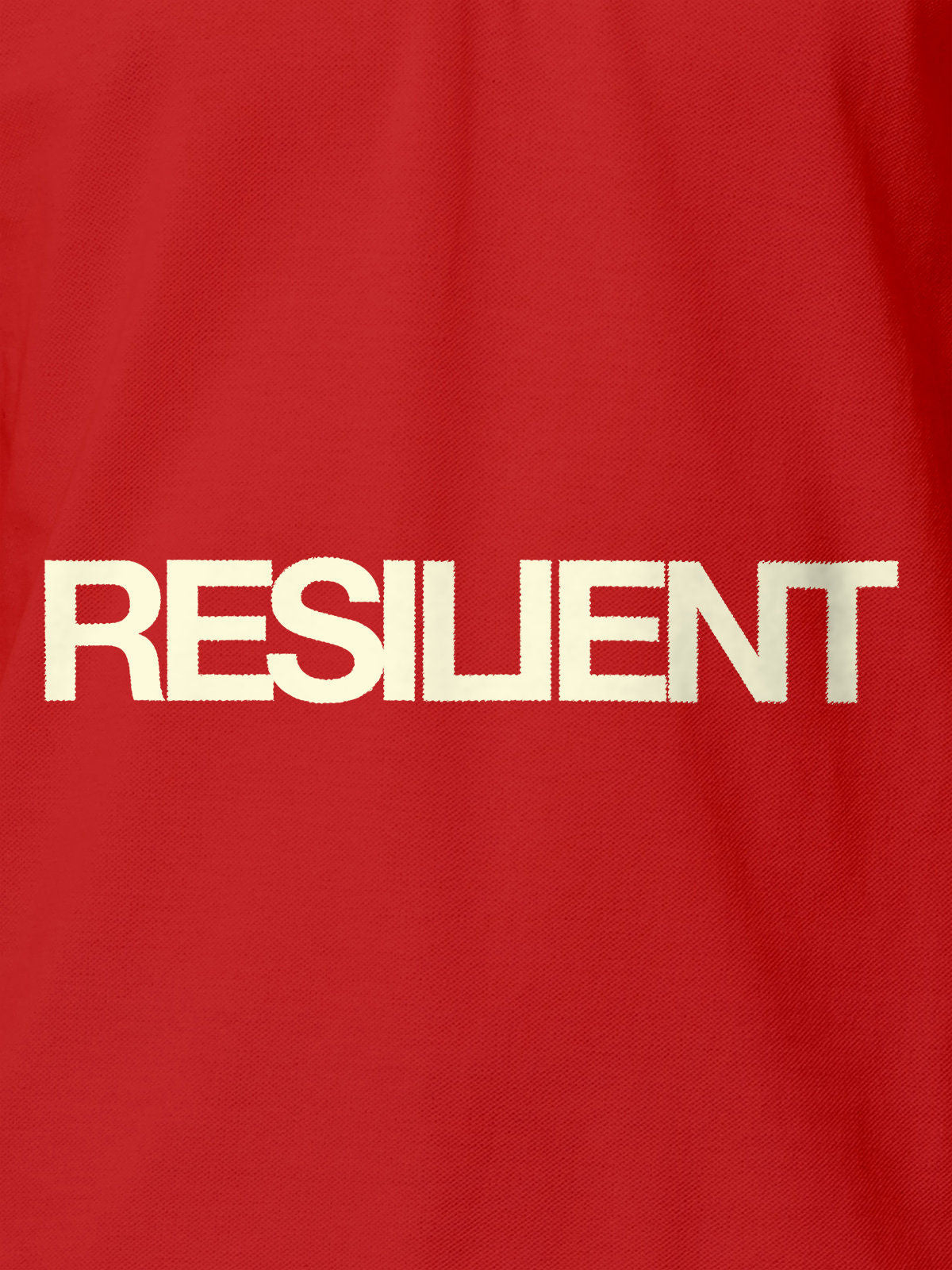 Close up of 'Resilient' design on Women's Red Polo T-shirt, highlighting intricate details and vibrant print.