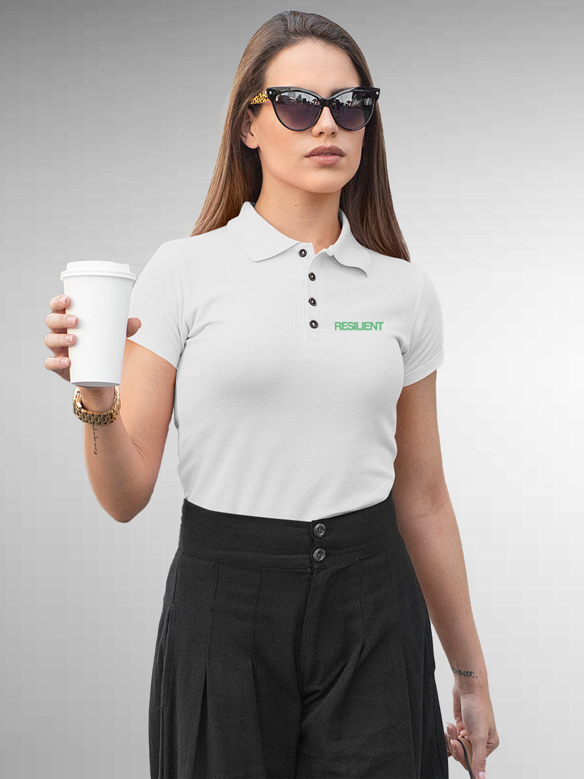 Model wearing Women's White Polo T-shirt with 'Resilient' design, offering effortless style and premium comfort