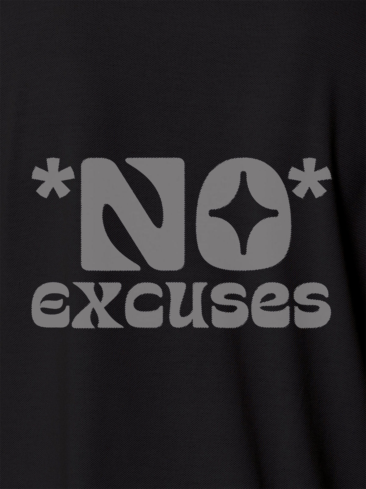 Close up of 'No Excuses' design on Women's Dark Grey Polo T-shirt, highlighting intricate details and vibrant print.