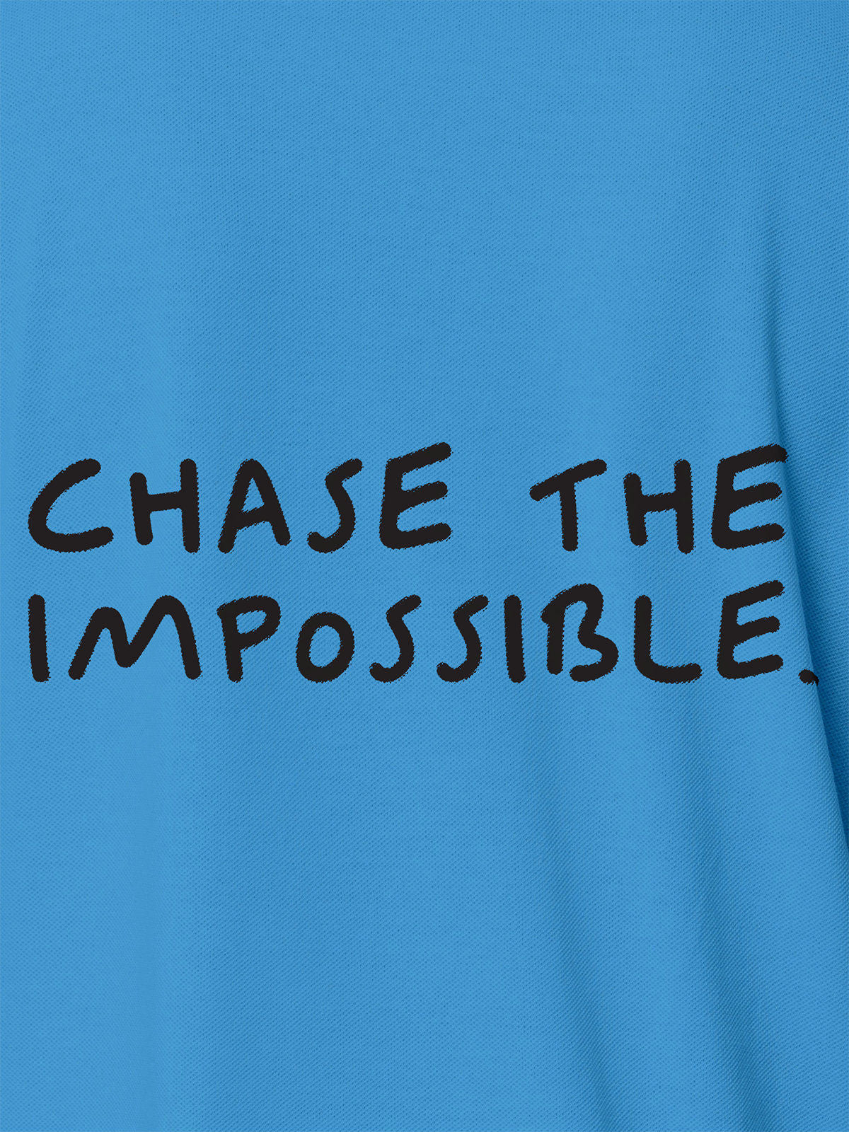 Close up of 'Chase The Impossible' design on Men's Blue Polo T-shirt, highlighting intricate details and vibrant print.