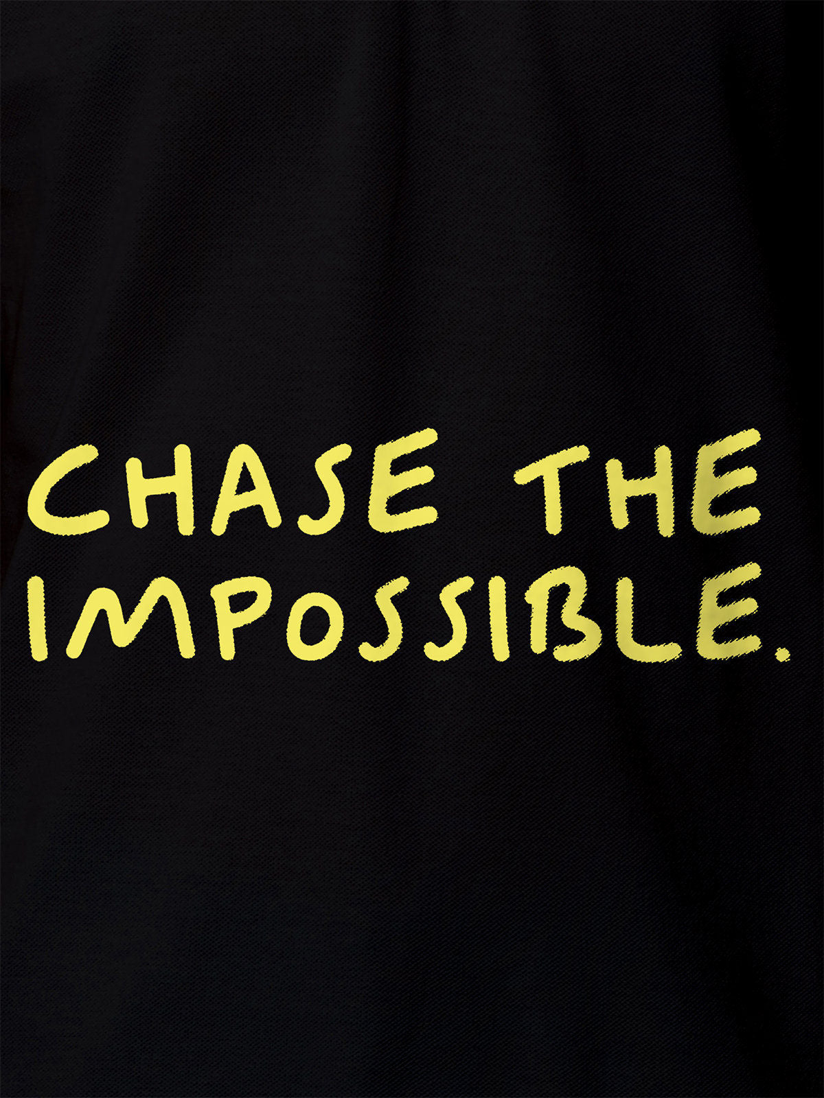 Close up of 'Chase The Impossible' design on Women's Black Polo T-shirt, highlighting intricate details and vibrant print.