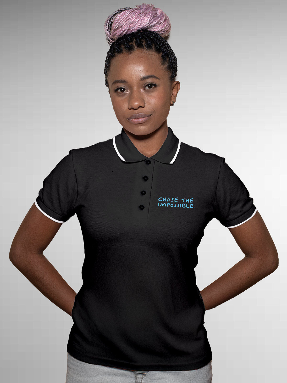 Model wearing Women's Dark Grey Polo T-shirt with 'Chase The Impossible' design, offering effortless style and premium comfort