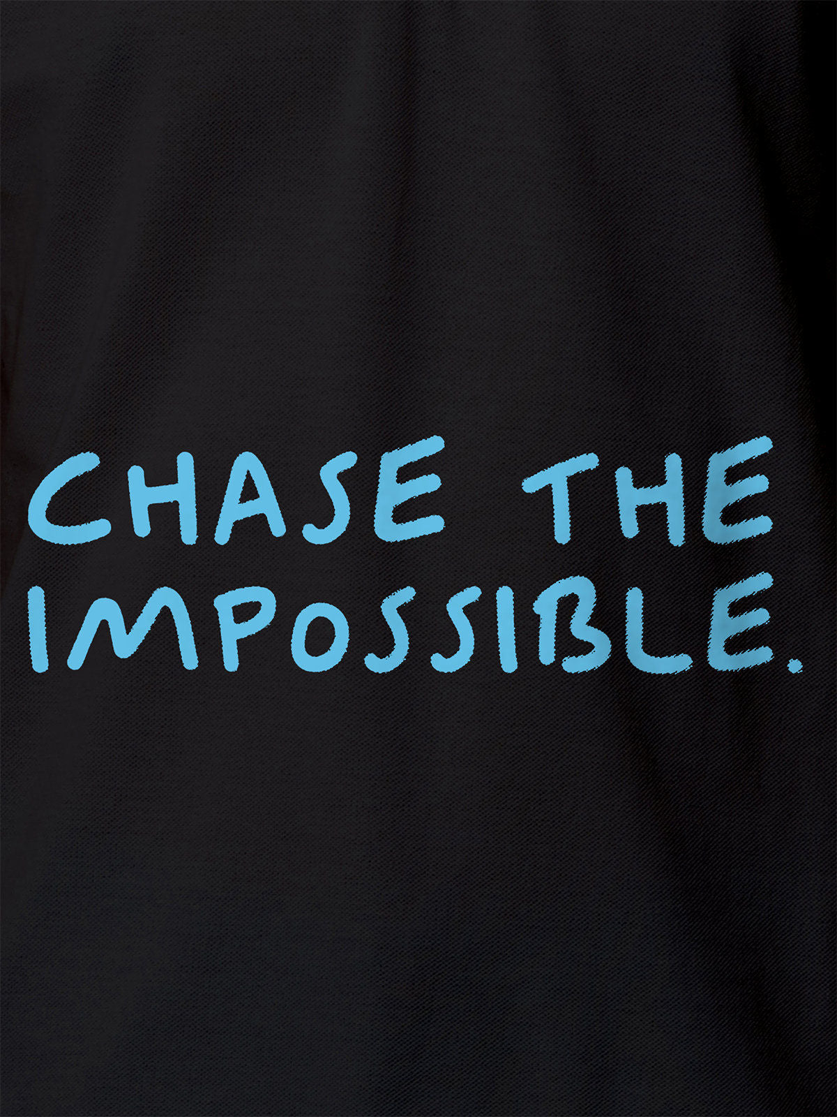 Close up of 'Chase The Impossible' design on Women's Dark Grey Polo T-shirt, highlighting intricate details and vibrant print.