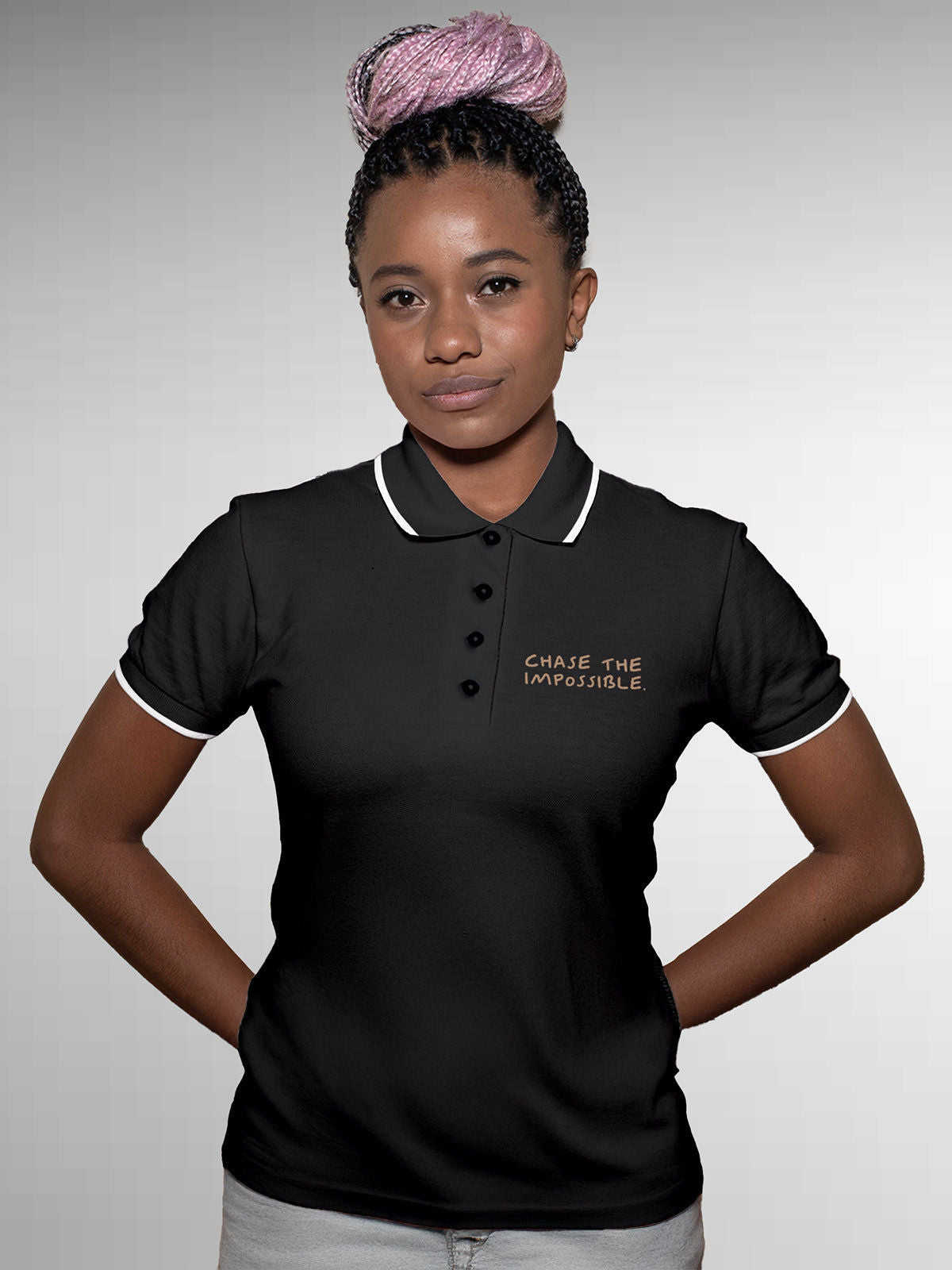Model wearing Women's Dark Grey Polo T-shirt with 'Chase The Impossible' design, offering effortless style and premium comfort