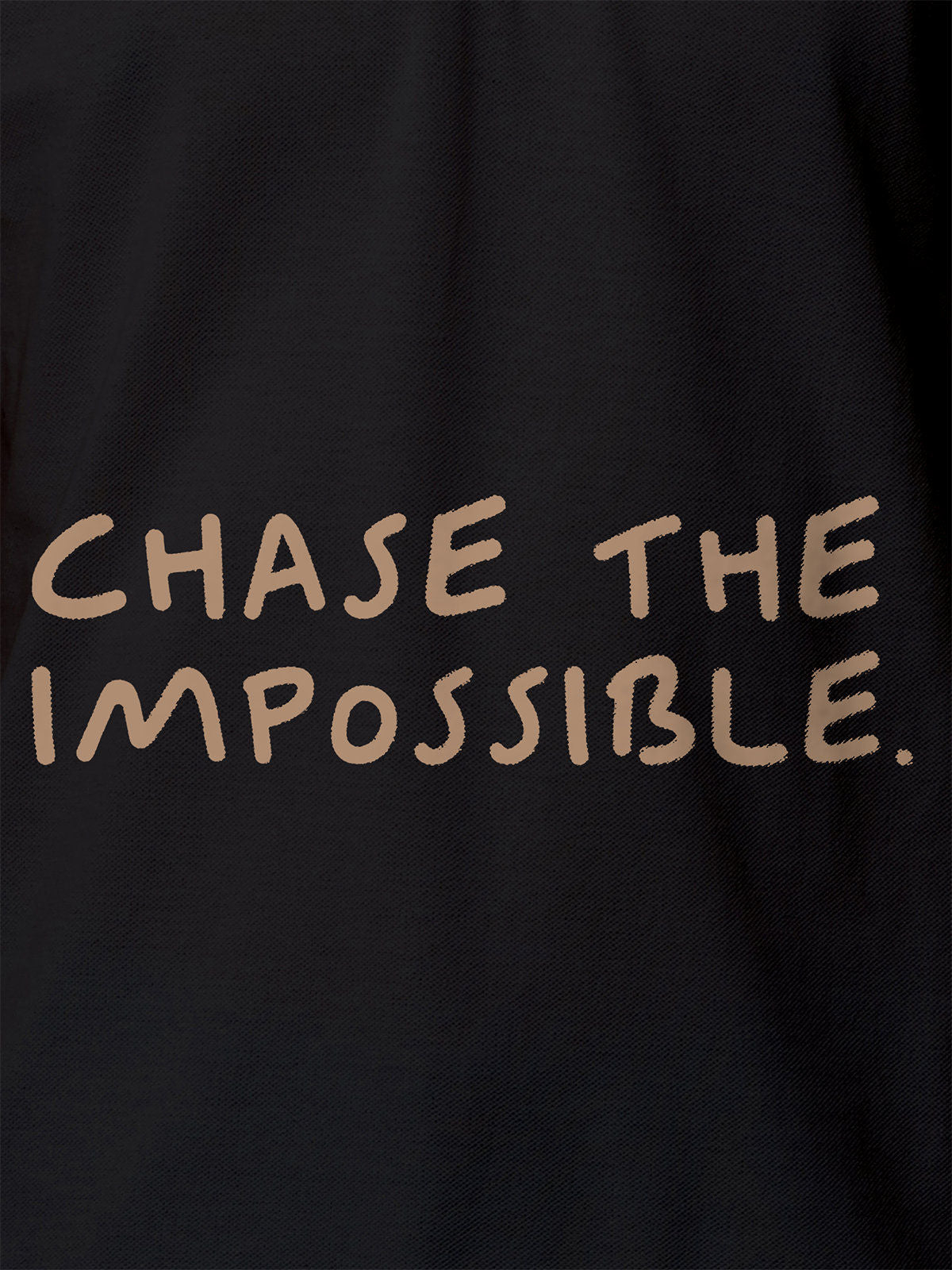 Close up of 'Chase The Impossible' design on Women's Dark Grey Polo T-shirt, highlighting intricate details and vibrant print.